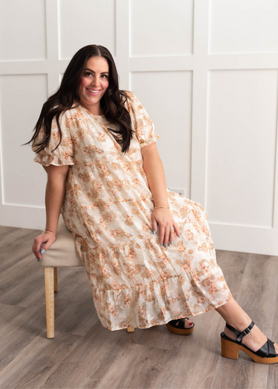 Plus size peach floral tiered dress with short sleeves