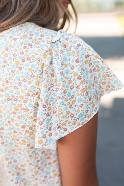 Close up of the sleeve and fabric onthe sage floral top