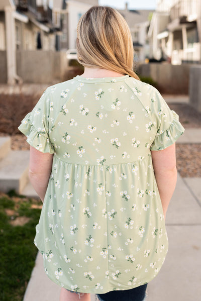 Back view of the plus size sage floral top
