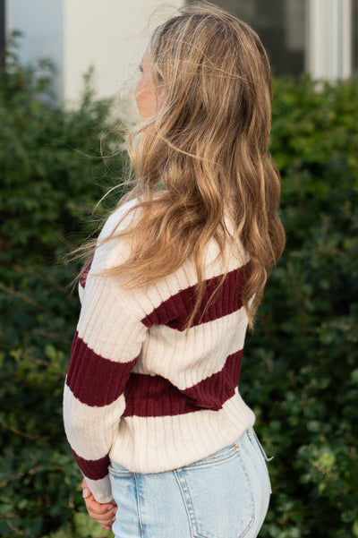 Side view of a cream sweater