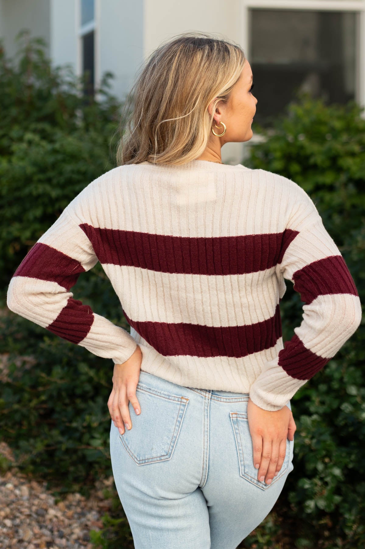 Back view of a cream sweater