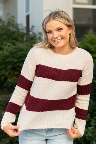 Cream sweater with burgundy stripes