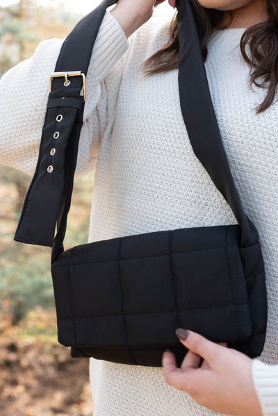 Black puff crossbody bag with adjustable strap