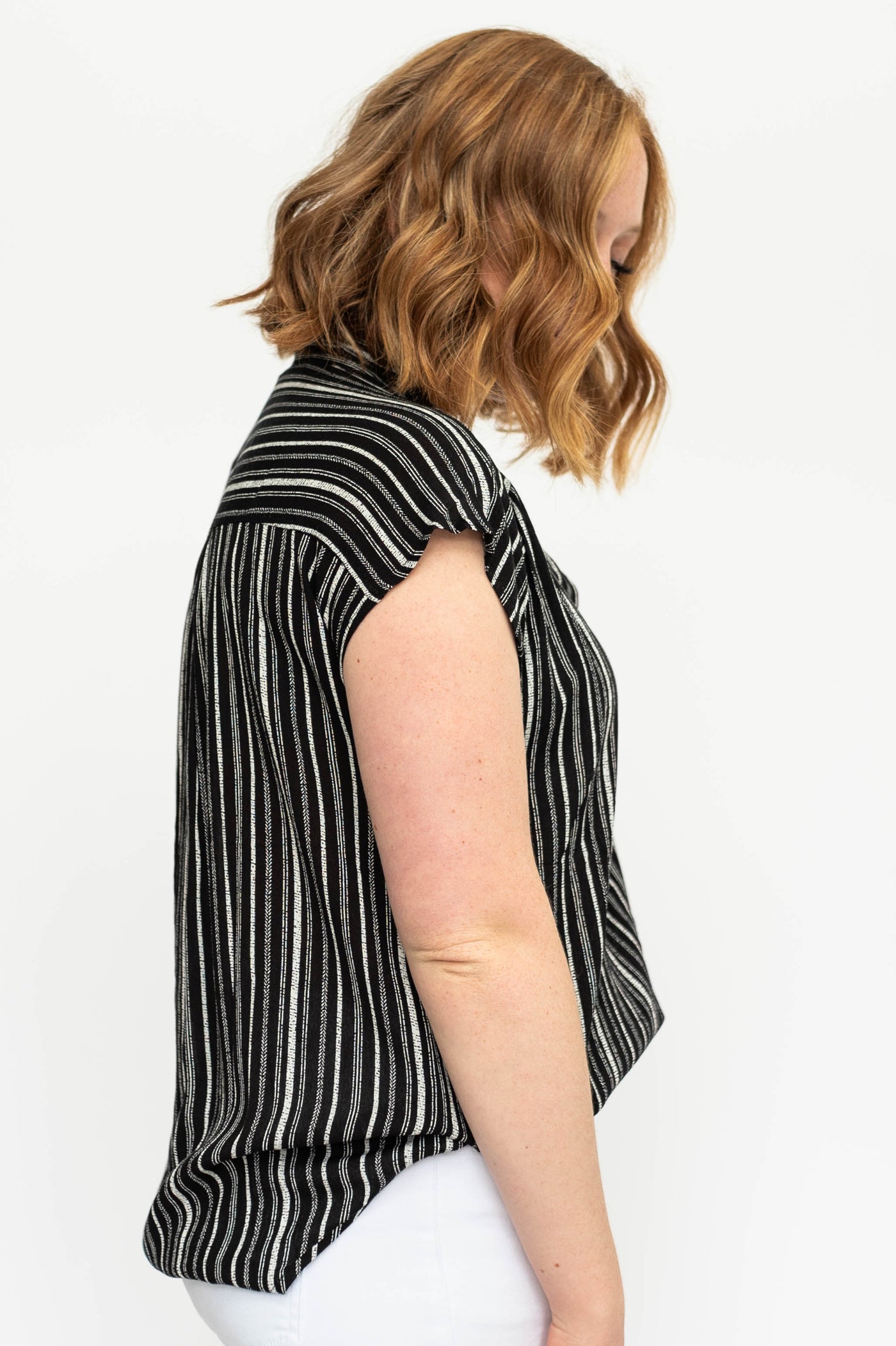 Side view of a short sleeve black top