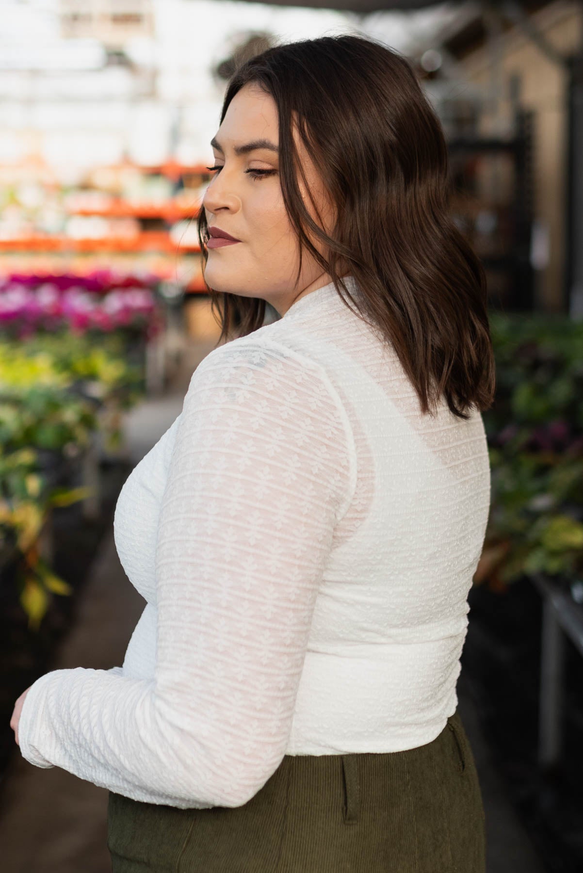 Side view of the plus size floral stretch lace top