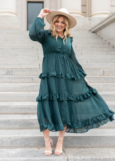 Long sleeve hunter green tiered dress with ruffles on the skirt
