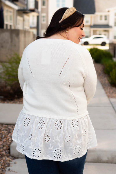 Back view of the plus size off white cardigan