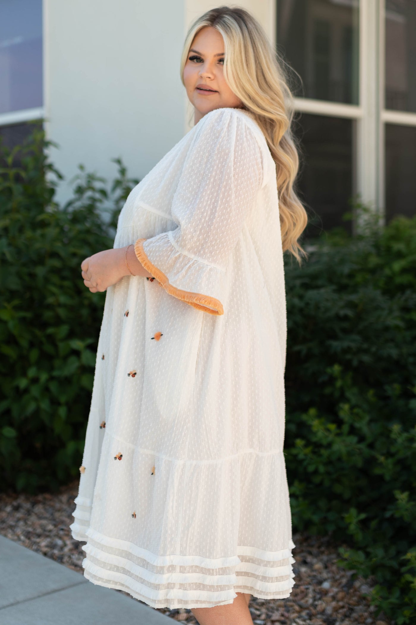 Side view of a plus size white dress