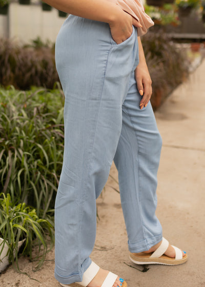Side view of small light denim pants with pockets