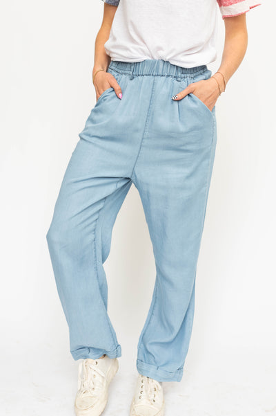 Front view of light denim pants with pockets