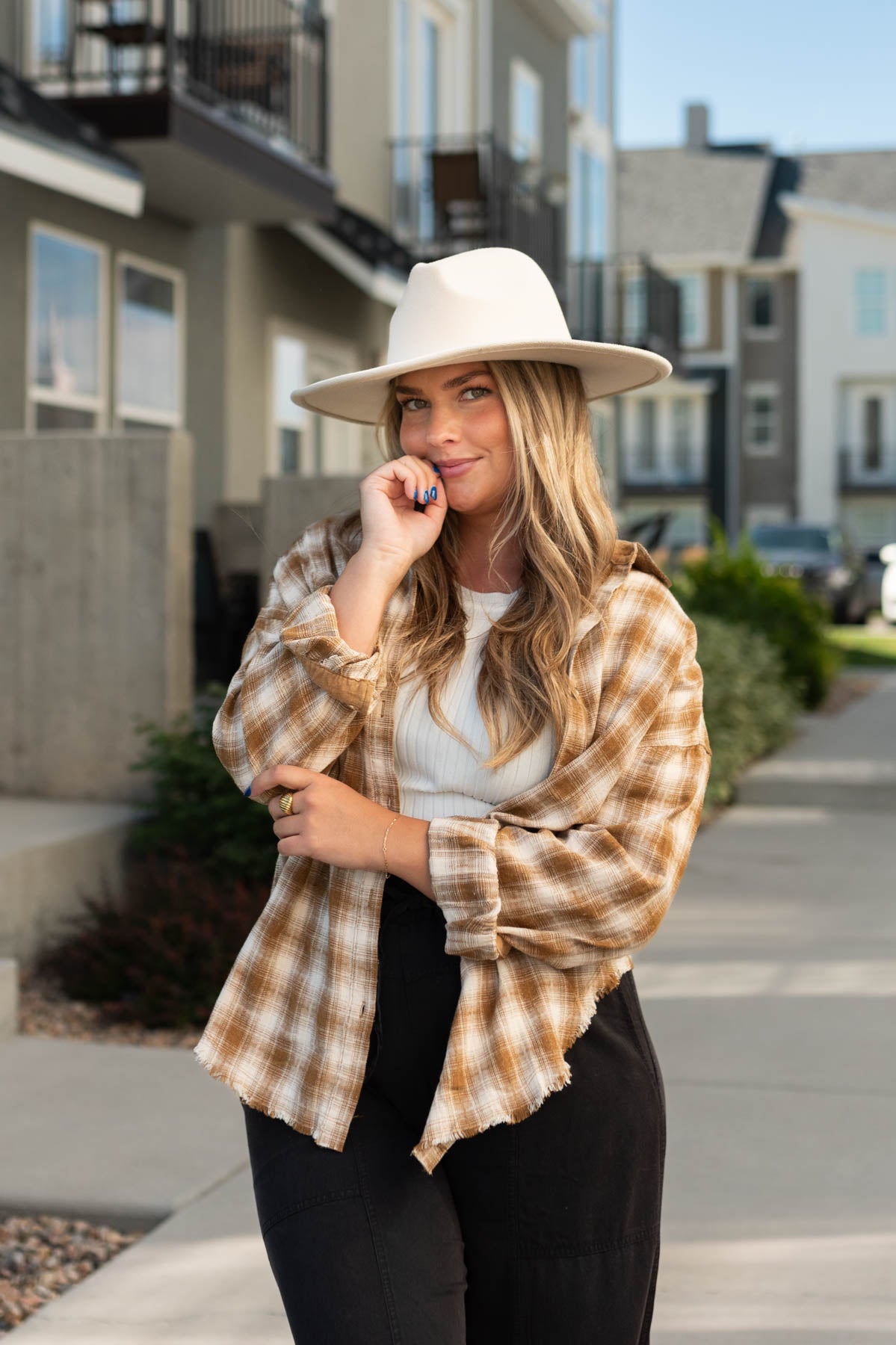 Caramel plaid top with a collar and buttons up