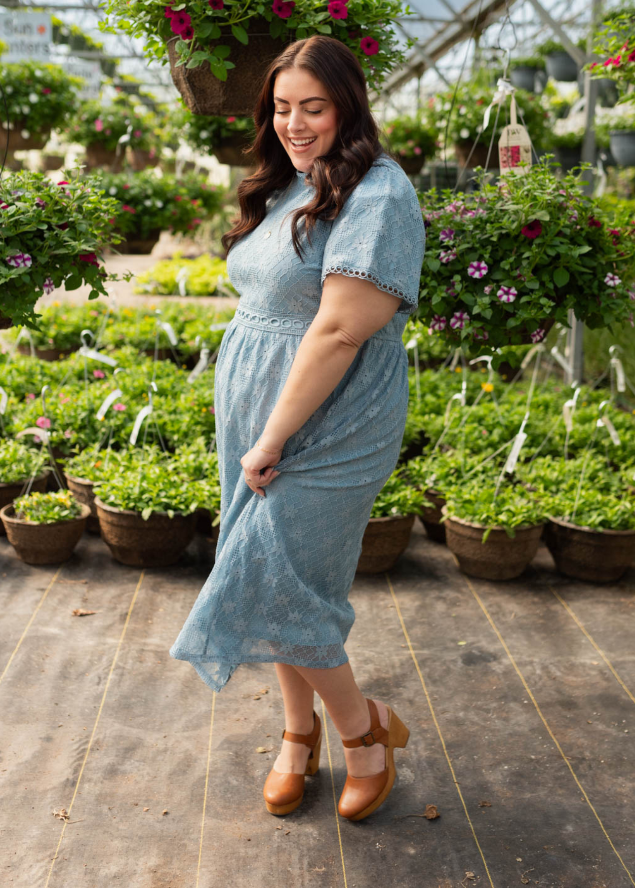 Side view of the plus size dusty blue corded lace dress