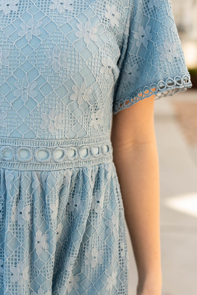 Close up of the fabric on the dusty blue corded lace dress