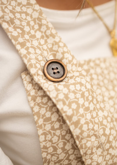 Buttons on beige overalls