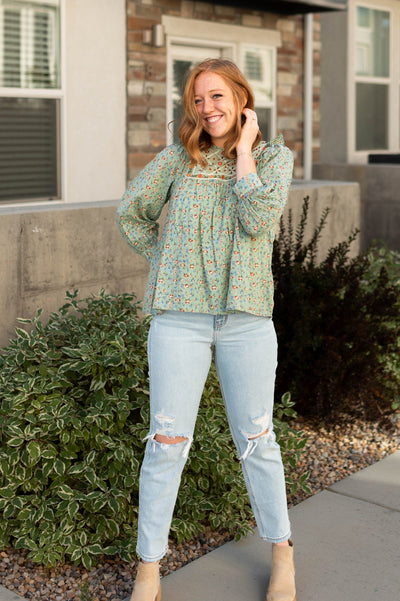 3/4 sleeve of a sage floral top