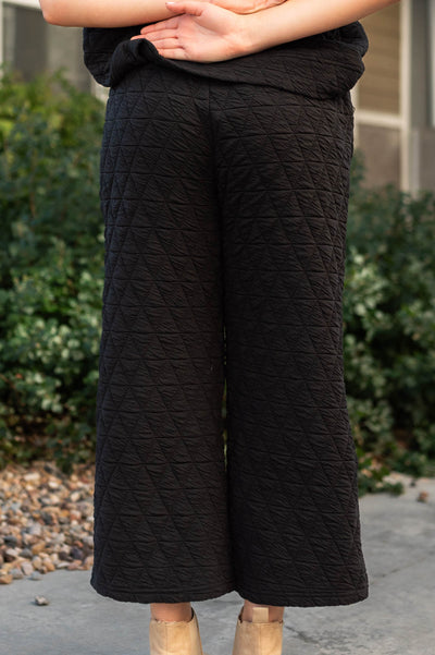Back view of black pants