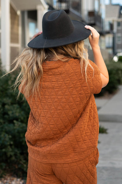Back view of a cinnamon top