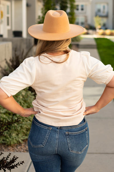 Back view of a beige top