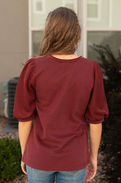 Back view of a burgundy top