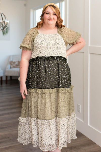 Plus size olive tiered dress with black and cream color blocks
