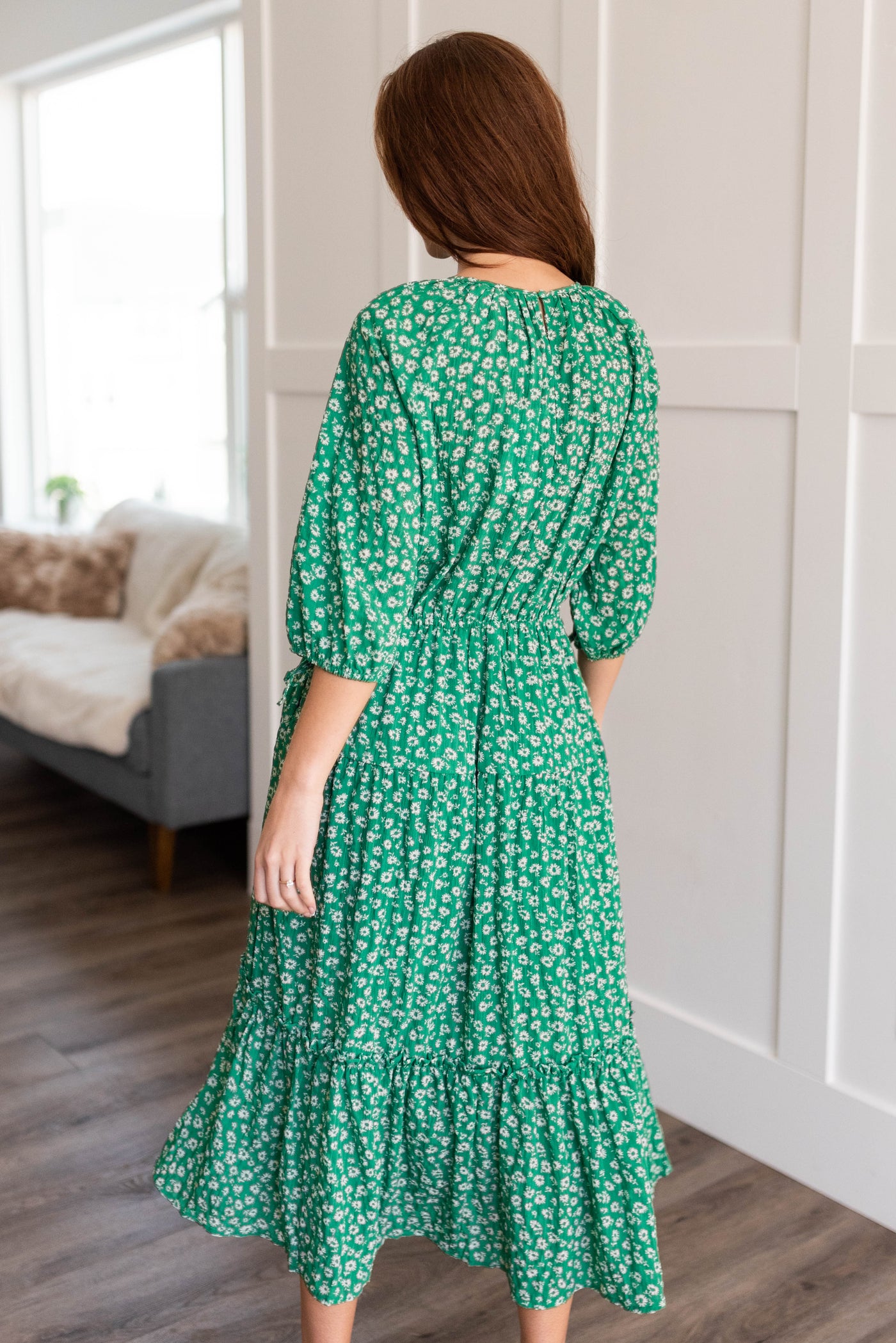 Back view of a green tiered dress