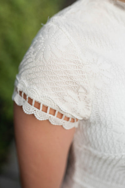 Close up of the sleeve on the ivory lace dress