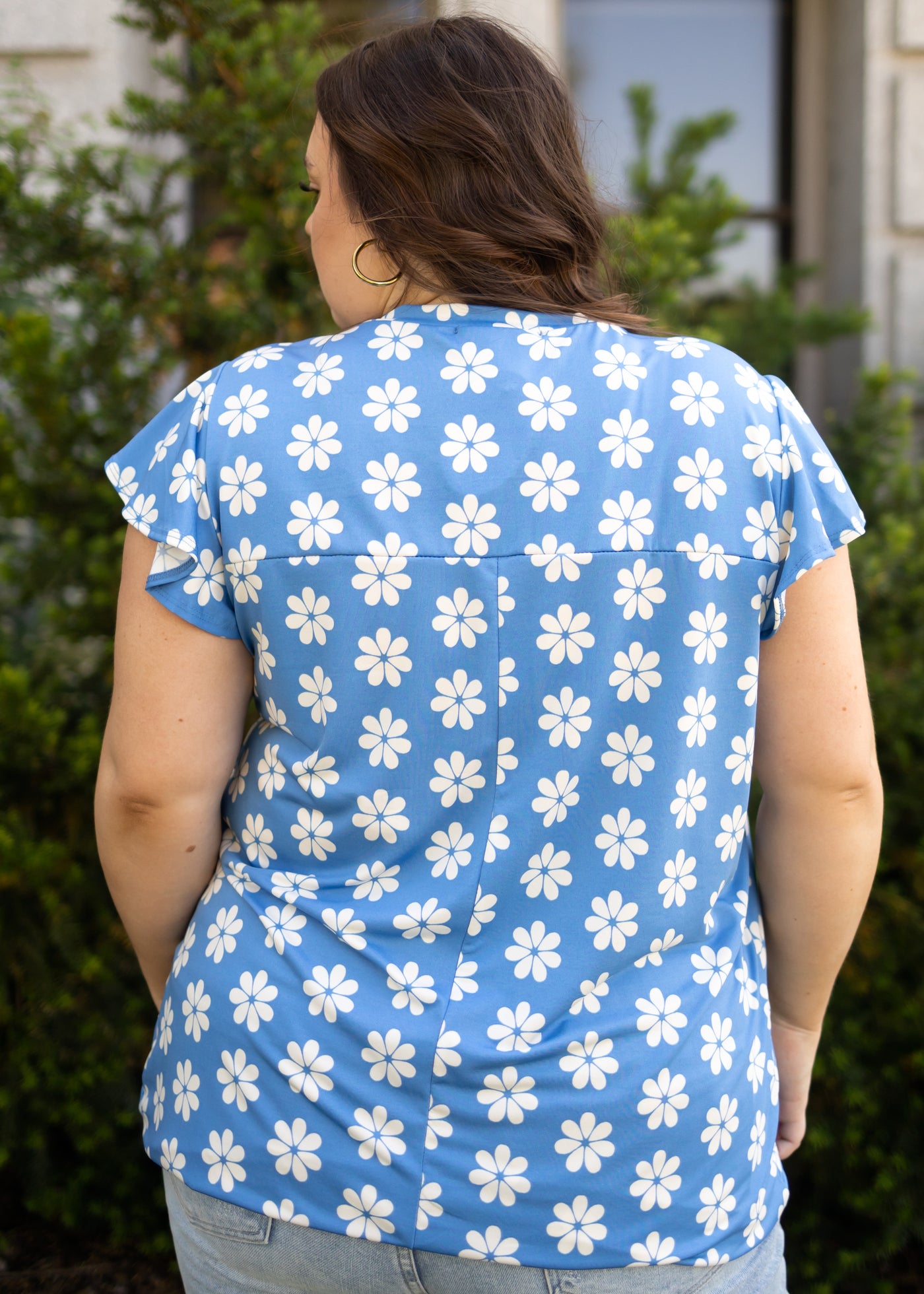 Back view of a plus size floral top