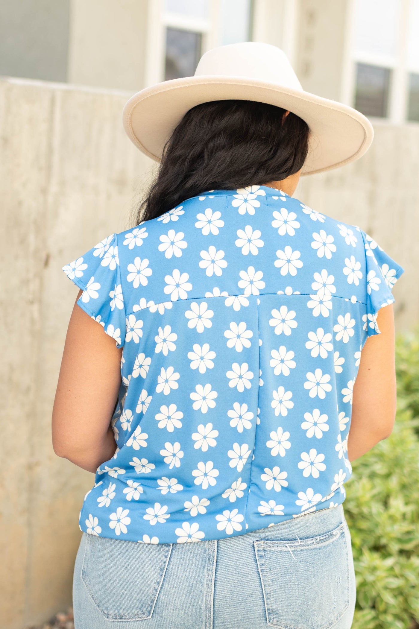 Back view of a blue floral top