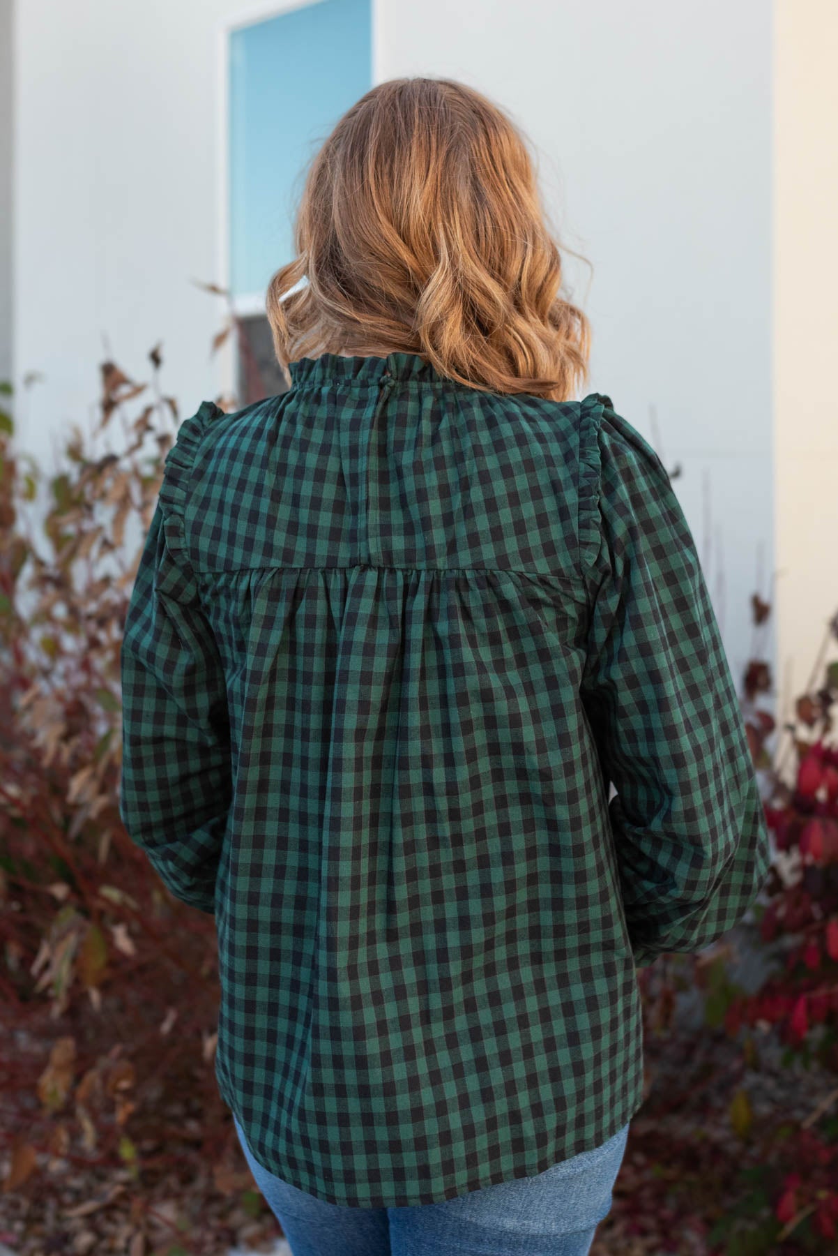 Back view of the hunter green ruffle blouse