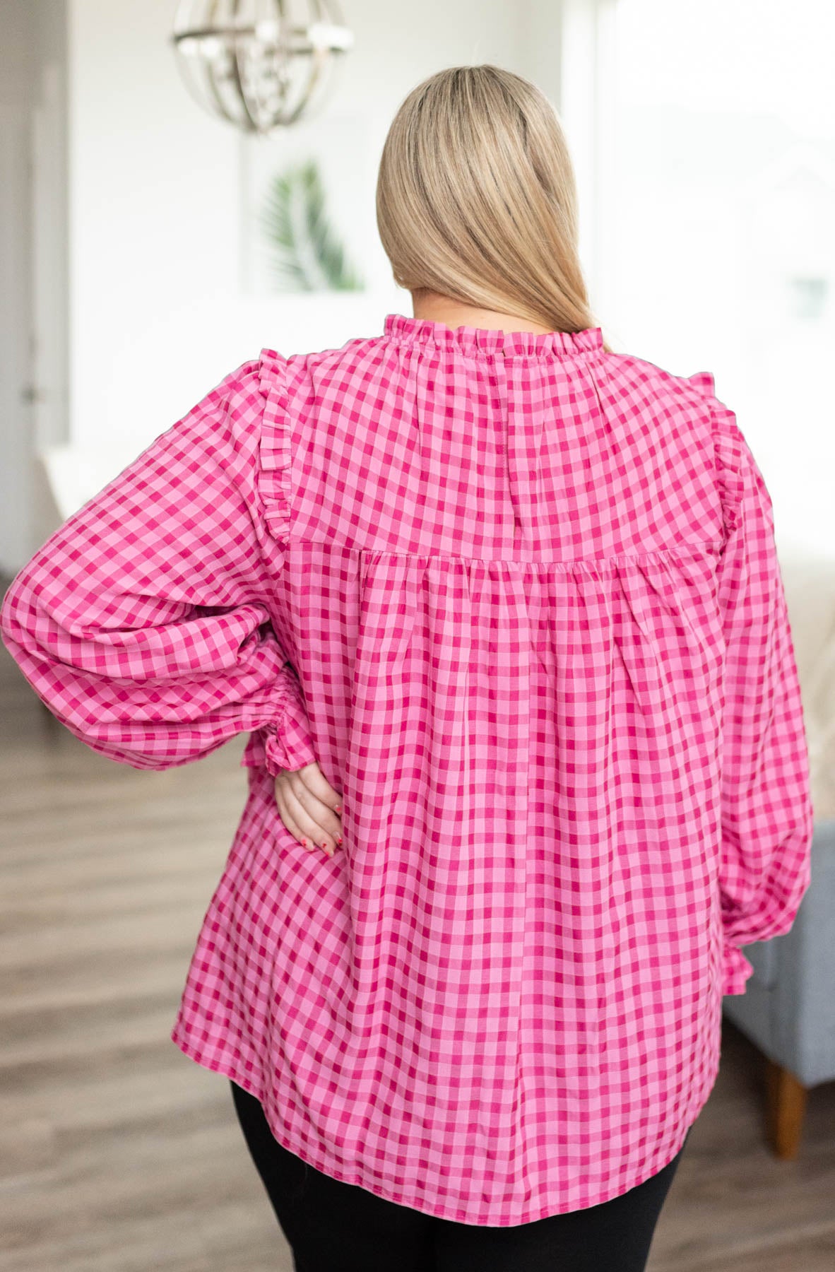 Back view of the plus size pink fuchsia ruffle blouse