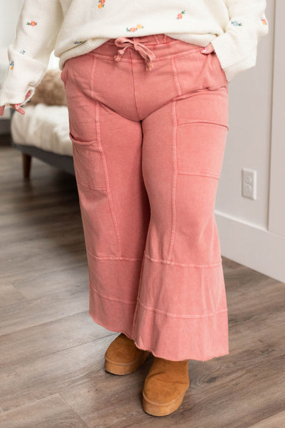 Front view of plus size mauve pants with elastic waist and pockets