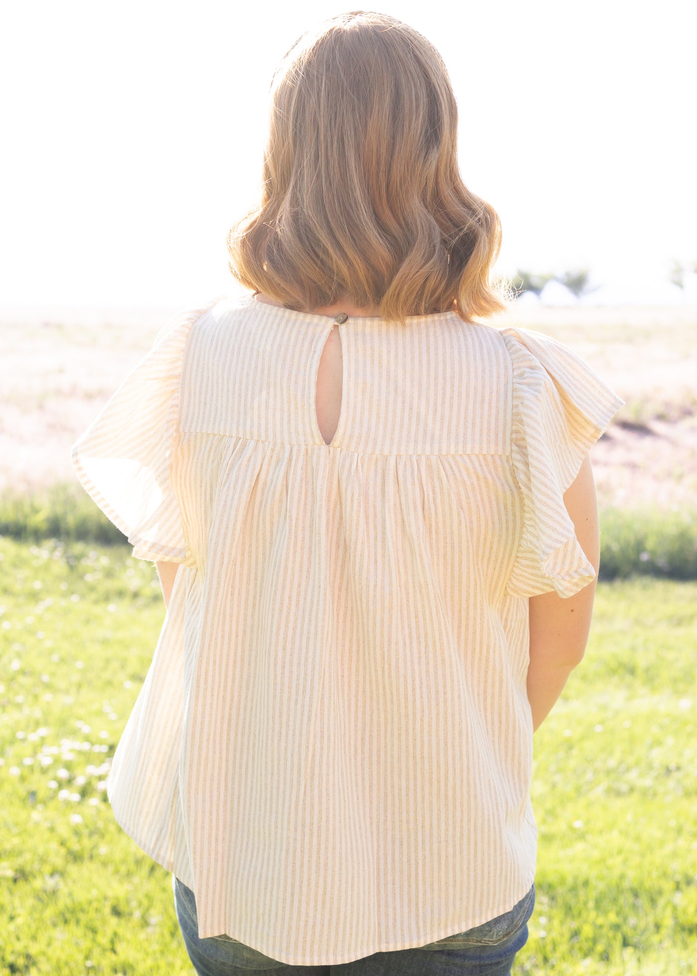 Back view of a taupe top