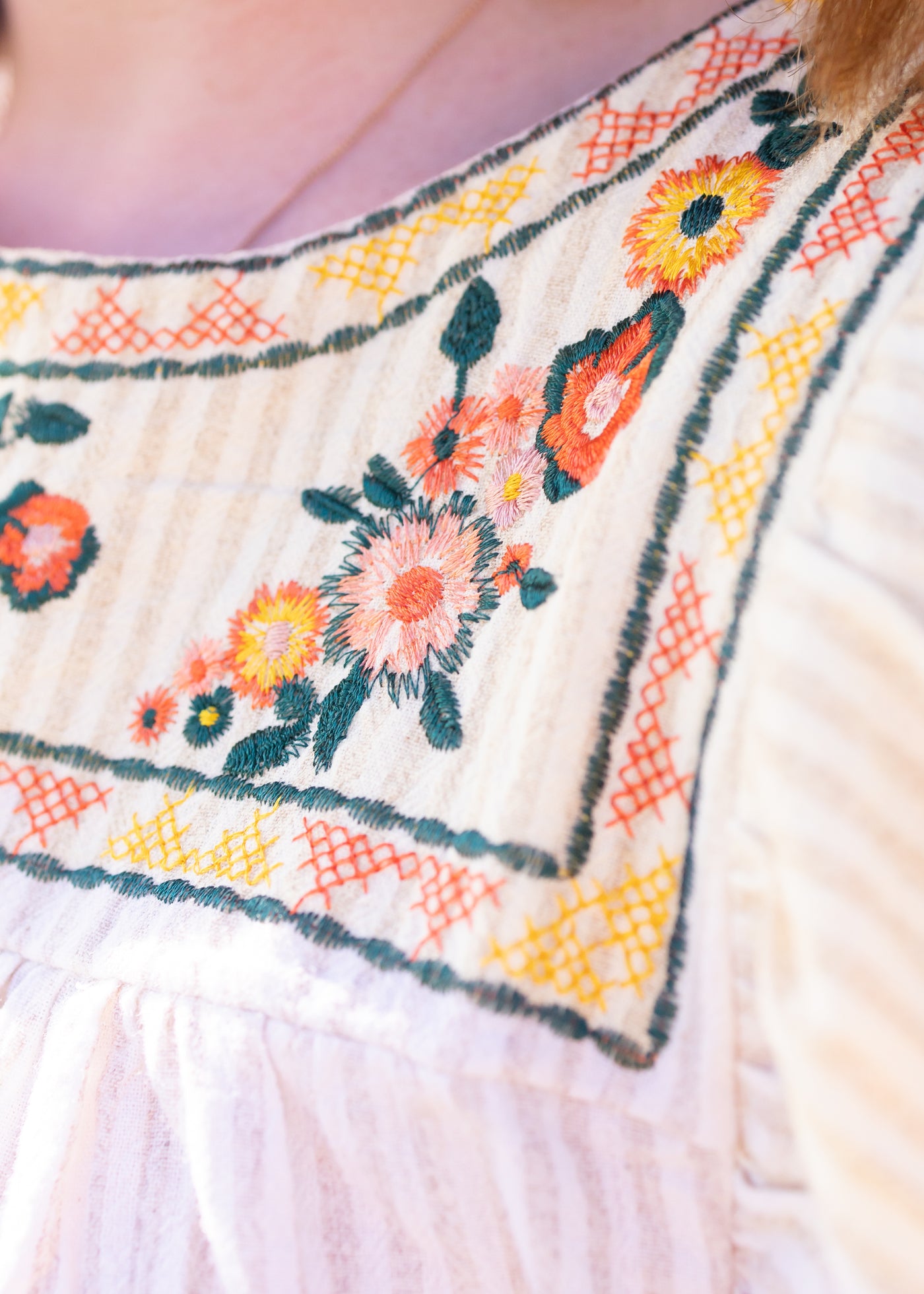 Embroidery of a taupe top
