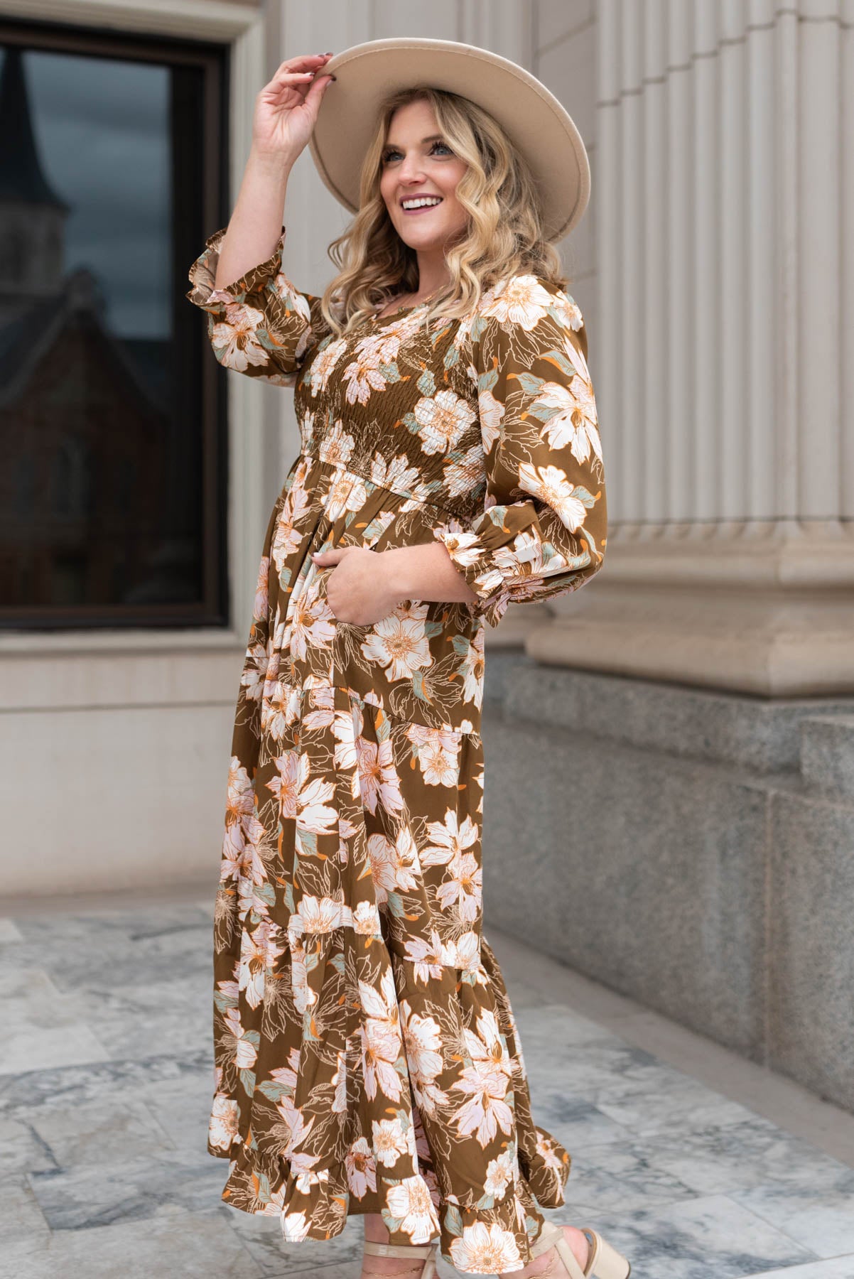 Side view of a brown floral dress with a smocked bodice