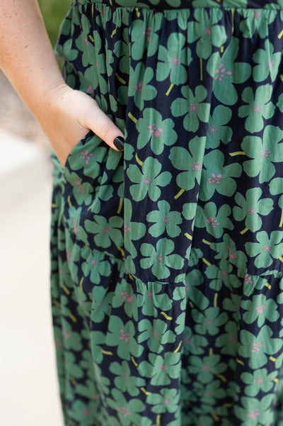 Plus size dark green dress with pockets and floral print