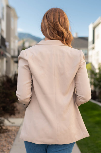 Back view of a beige blazer