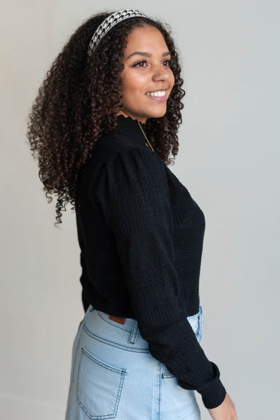 Side view of the black pattern sweater