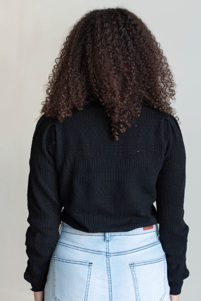 Back view of the black pattern sweater