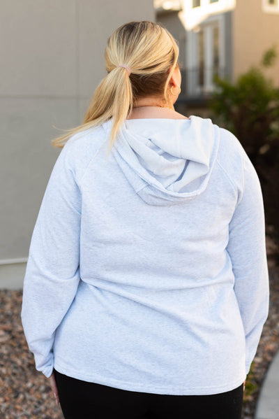 Back view of a grey button hoddie 