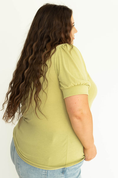 Side view of Plus size kiwi colored knit top.