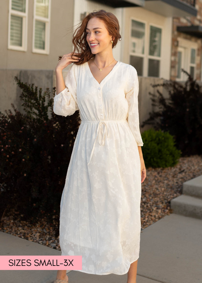 Long sleeve cream dress that ties at the waist