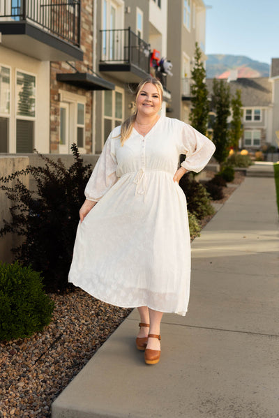Plus size cream dress that is lined
