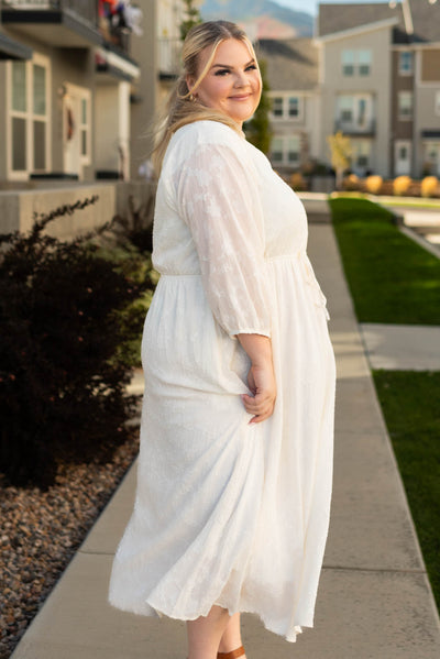 Side view of the plus size cream dress