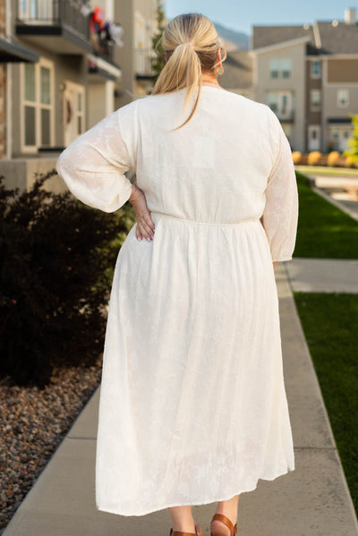 Back view of the plus size cream dress