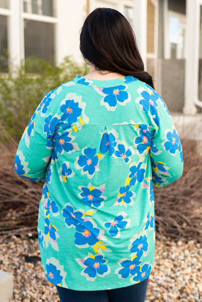 Back view of the plus size green floral top