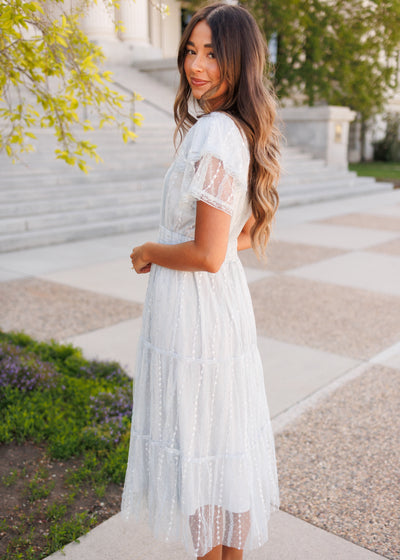 Side view of the dusty blue lace dress