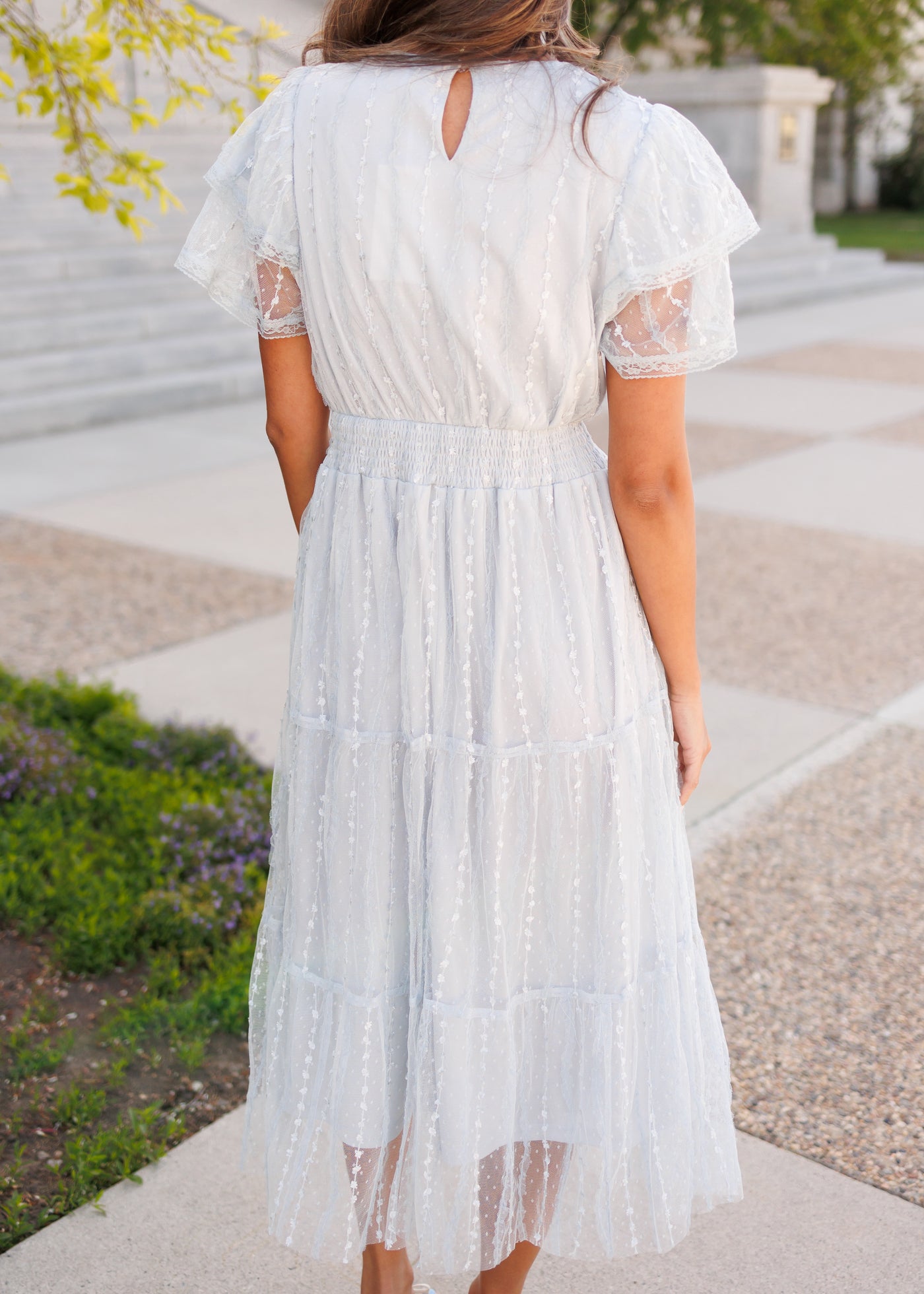 Back view of the dusty blue lace dress