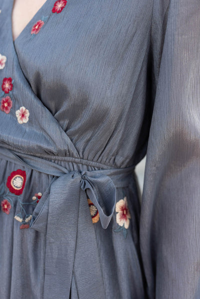 Close up of the waist of the charcoal floral wrap dress