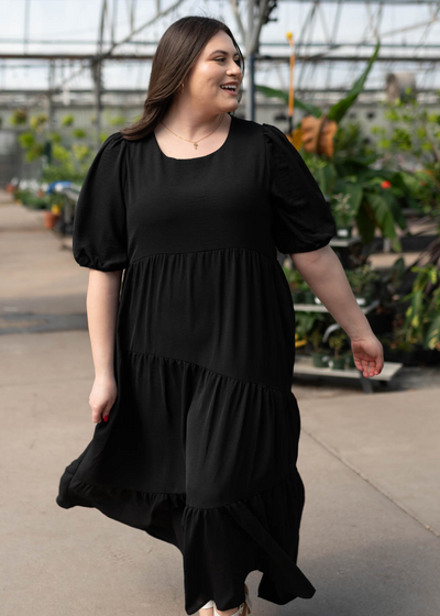 Plus size black tiered dress with short sleeves