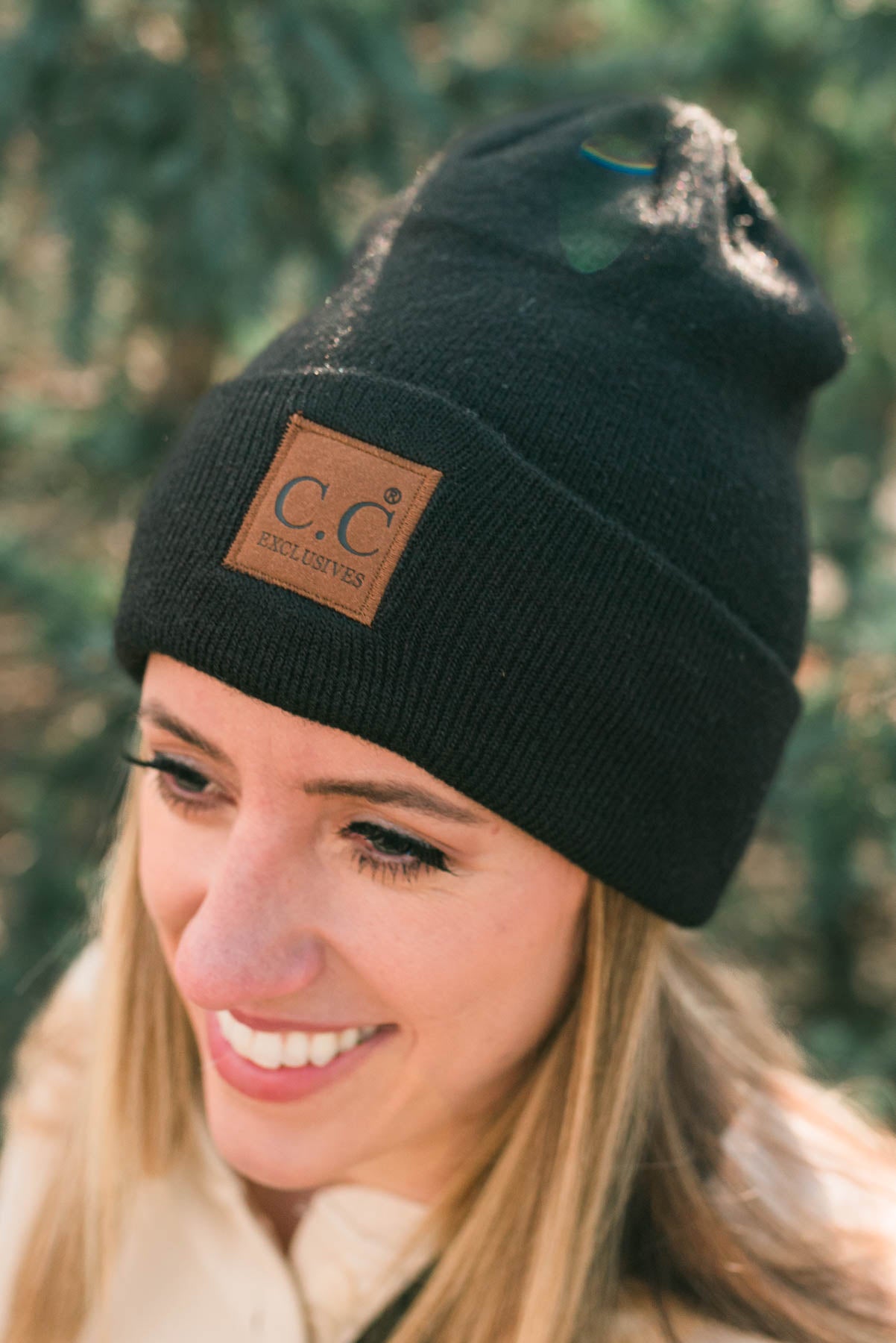 Black knit beanie with brown C.C. patch